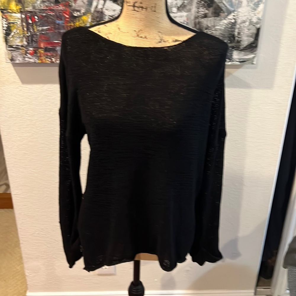 Simple loose fit black sweater. XS but will fit size 6-8